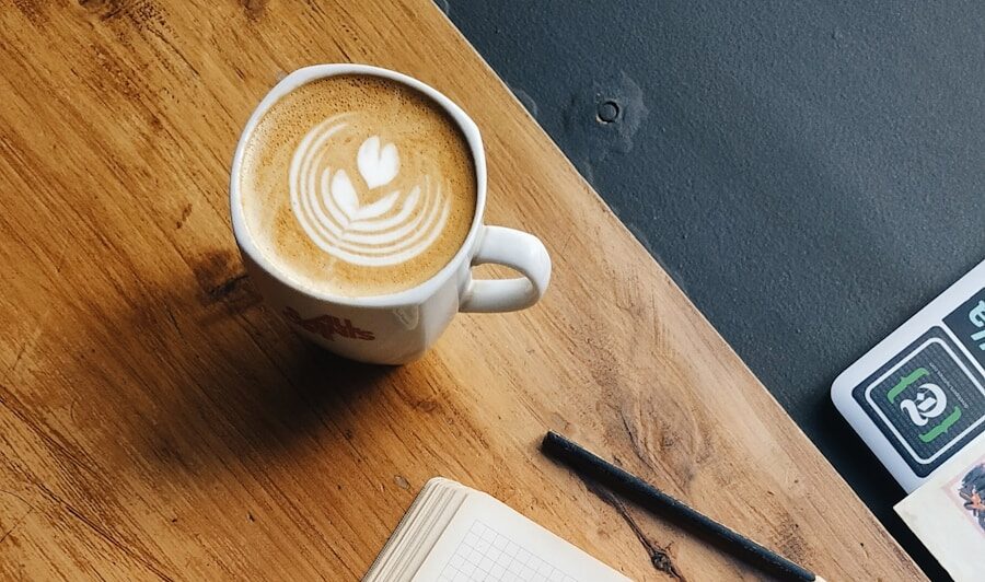 white ceramic mug on brown wooden table